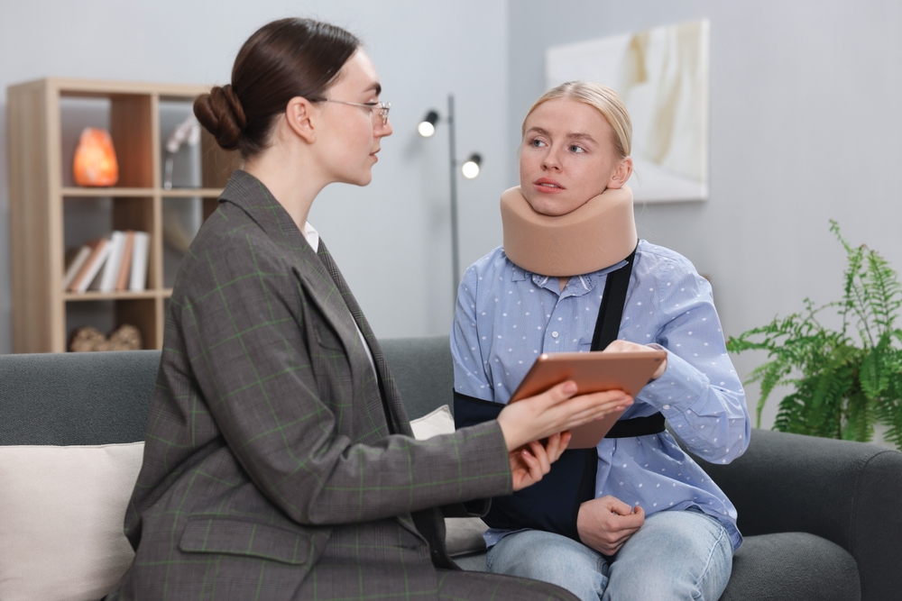 Injured,Woman,Having,Meeting,With,Lawyer,In,Office